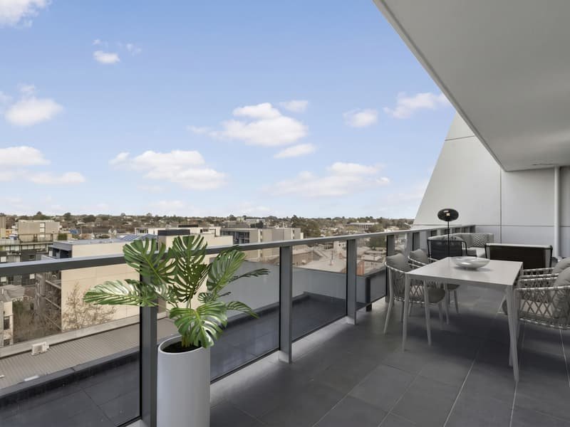 Apartment balcony with outdoor dining and views over Prahran